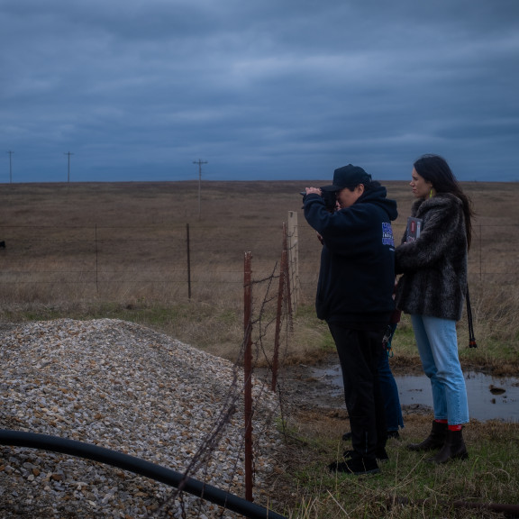 Two people take photos outside. Photo by Tara Pixley