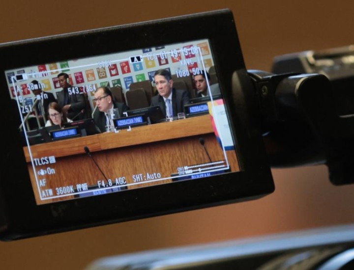 A video camera records speakers on a UN panel