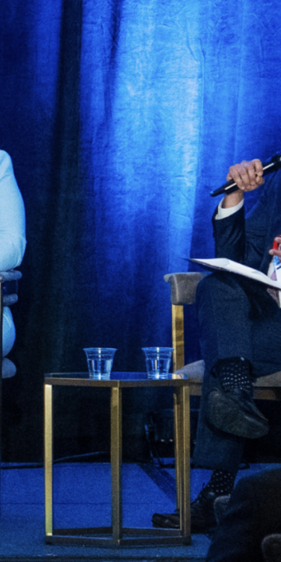 People speak on a panel
